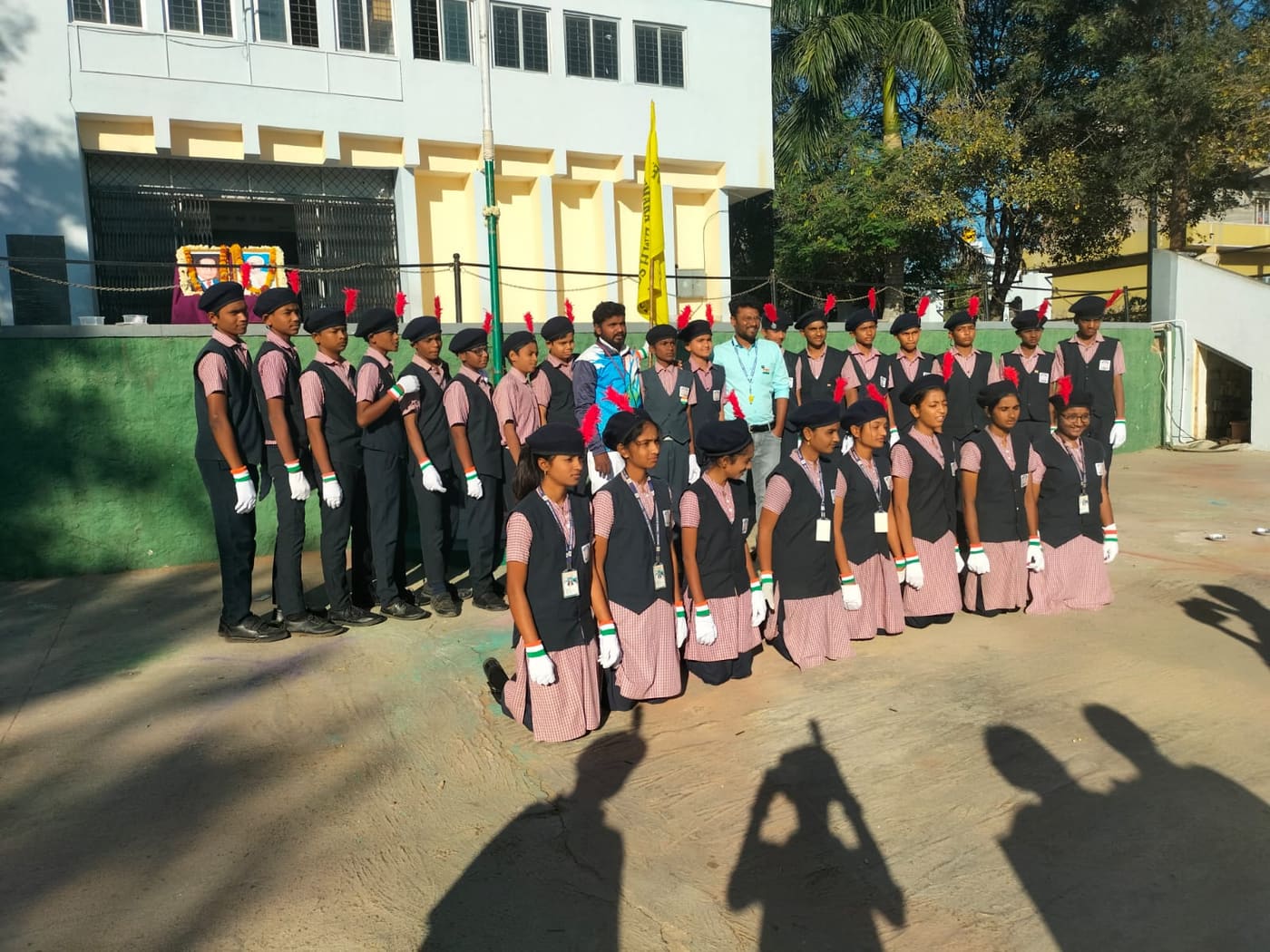 Students in ceremonial uniform lined up outside the school